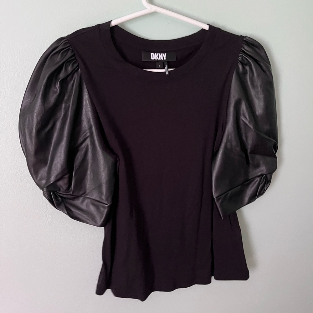 Never worn black DKNY top with faux leather sleeves.